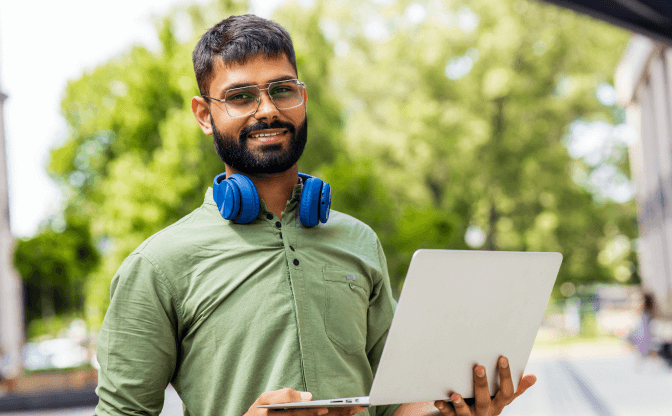 portrait-indian-student-programmer-using-laptop-co-2022-08-13-21-16-06-utc 1
